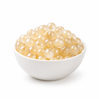 Water chestnut popping boba with visible ivory centers in a deep white bowl — product content