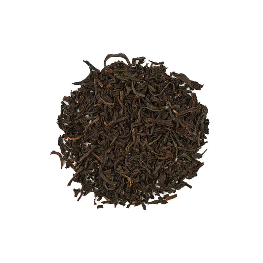 Loose leaf Earl Grey black tea with finely rolled dark tea leaves, ready for brewing into commercial tea bases.